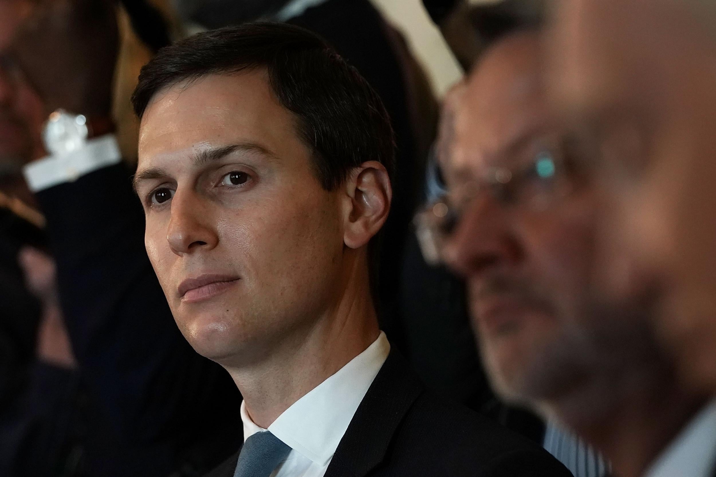 Jared Kushner listens during a meeting between President Donald Trump and congressional members