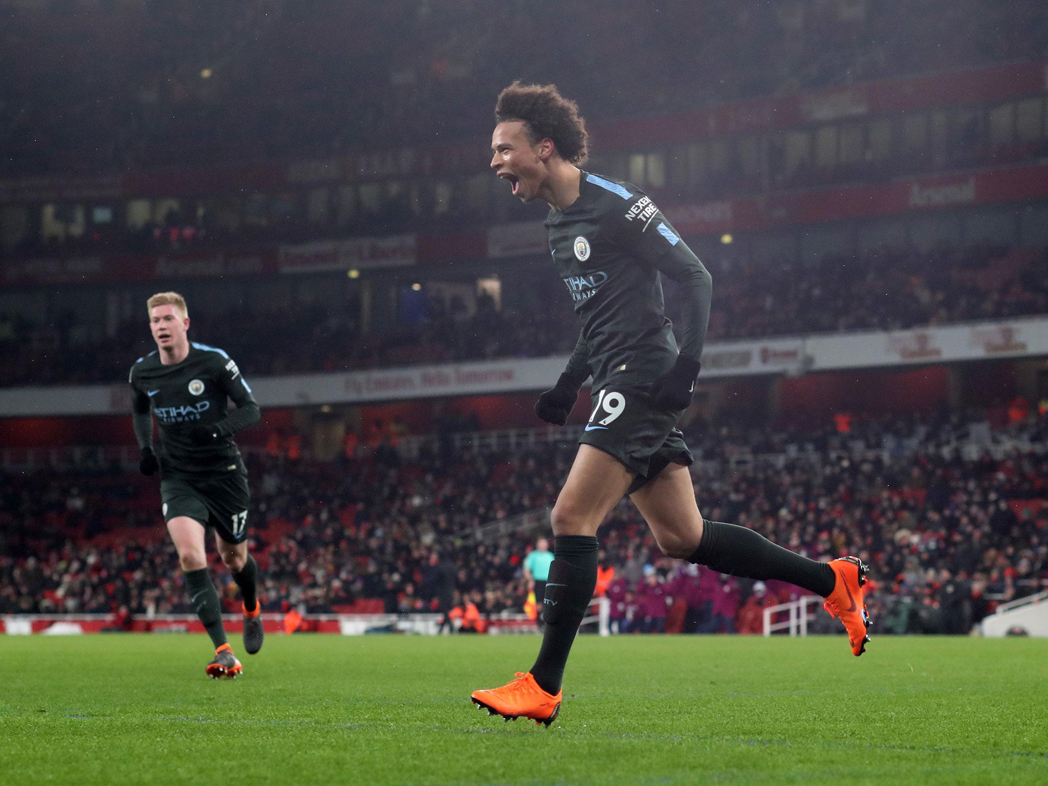 &#13;
Leroy Sane celebrates scoring Manchester City's third of the evening &#13;