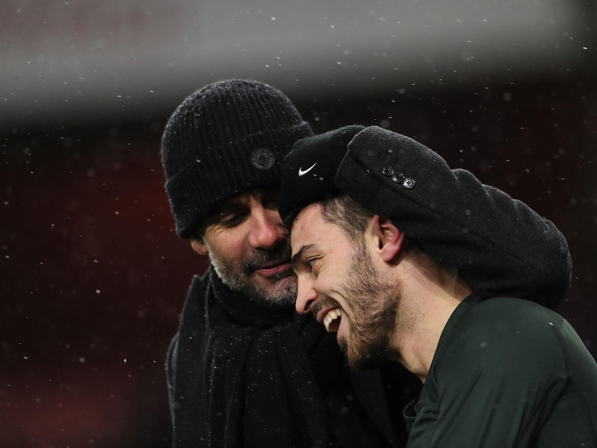 Pep Guardiola with Bernardo Silva after the final whistle at the Emirates