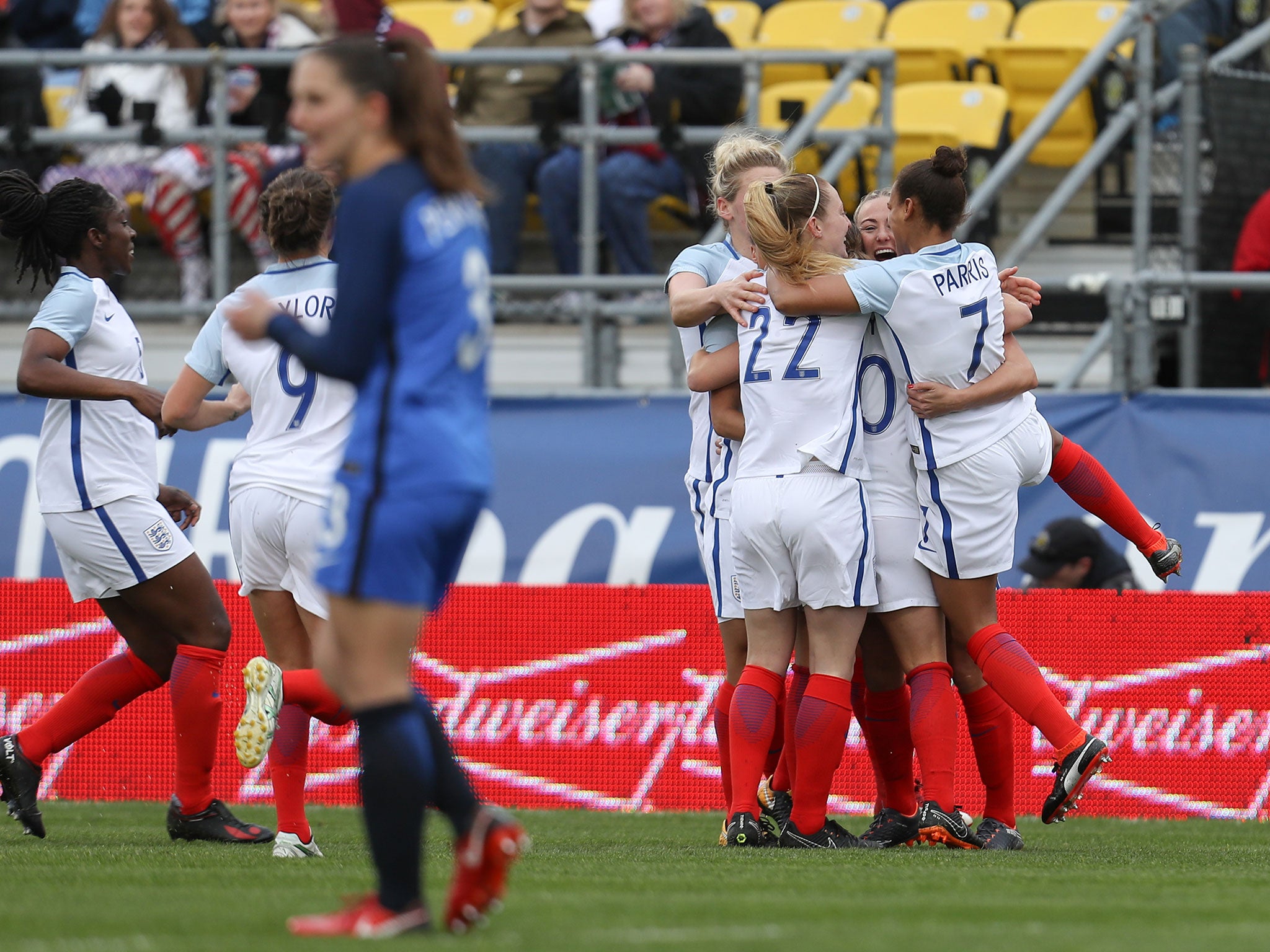 Jill Scott celebrates with her England teammates after scoring against France
