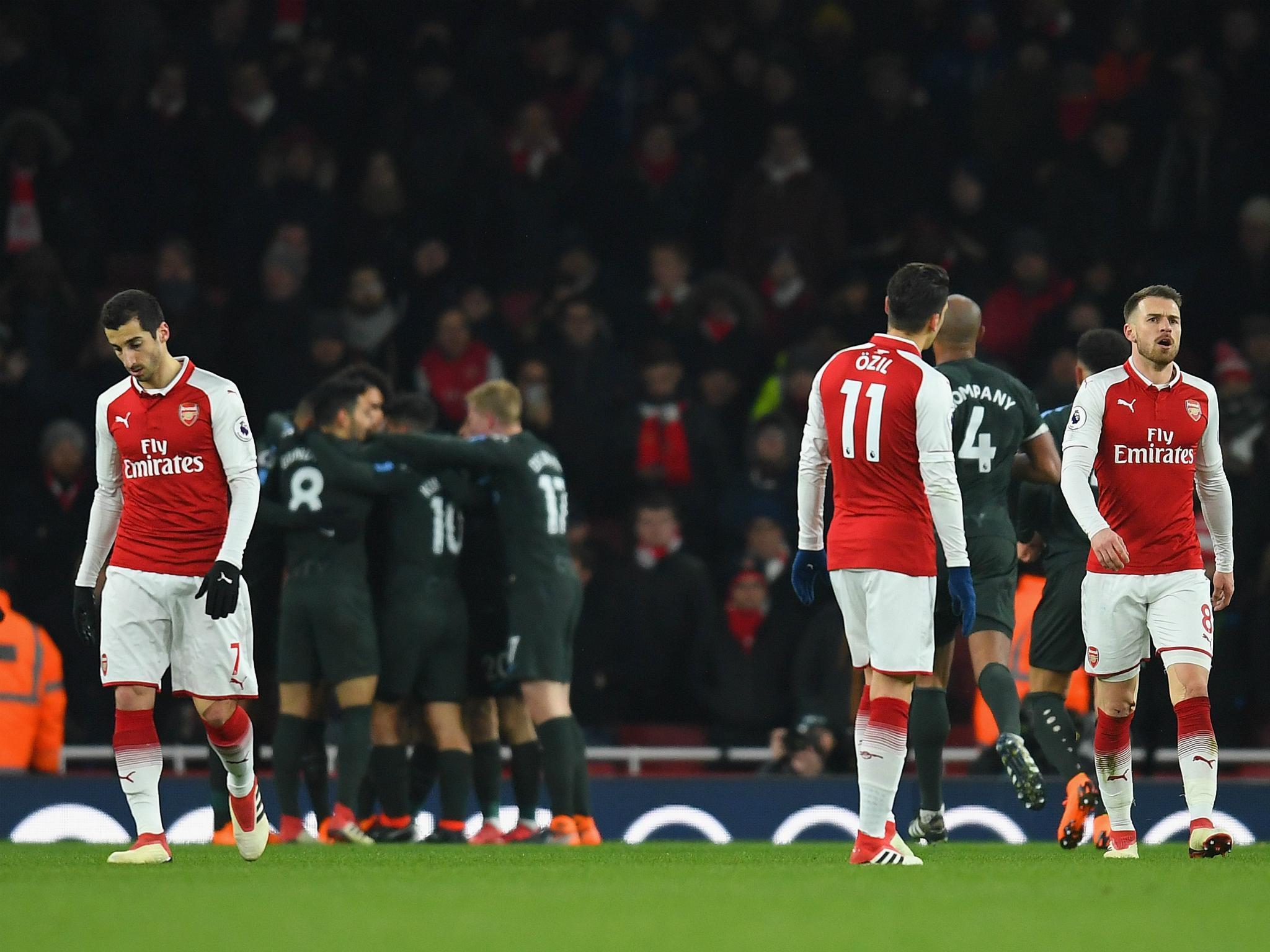 Arsene Wenger has spoken of his need to rebuild his players' confidence after the defeats by Manchester City