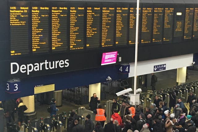 Waterloo surrender: commuters waiting for delayed trains at Britain’s busiest station