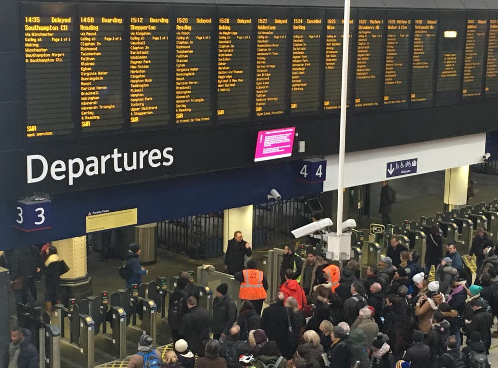 Waterloo surrender: commuters waiting for delayed trains at Britain’s busiest station