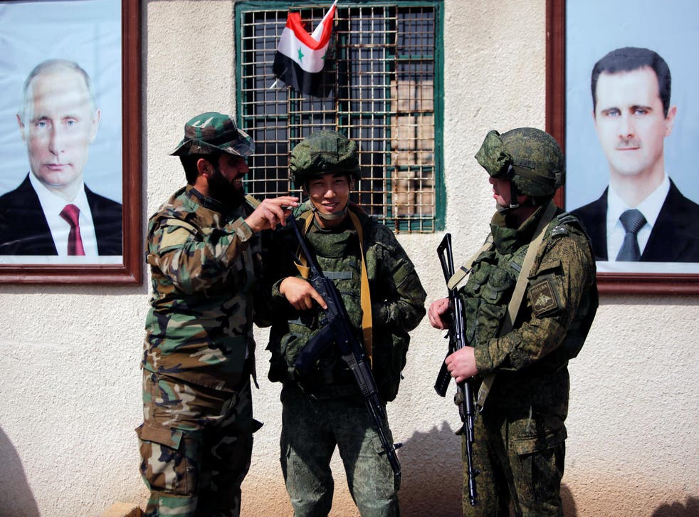 Syrian and Russian soldiers at a checkpoint near Wafideen camp in Damascus, Syria on 2 March 2018