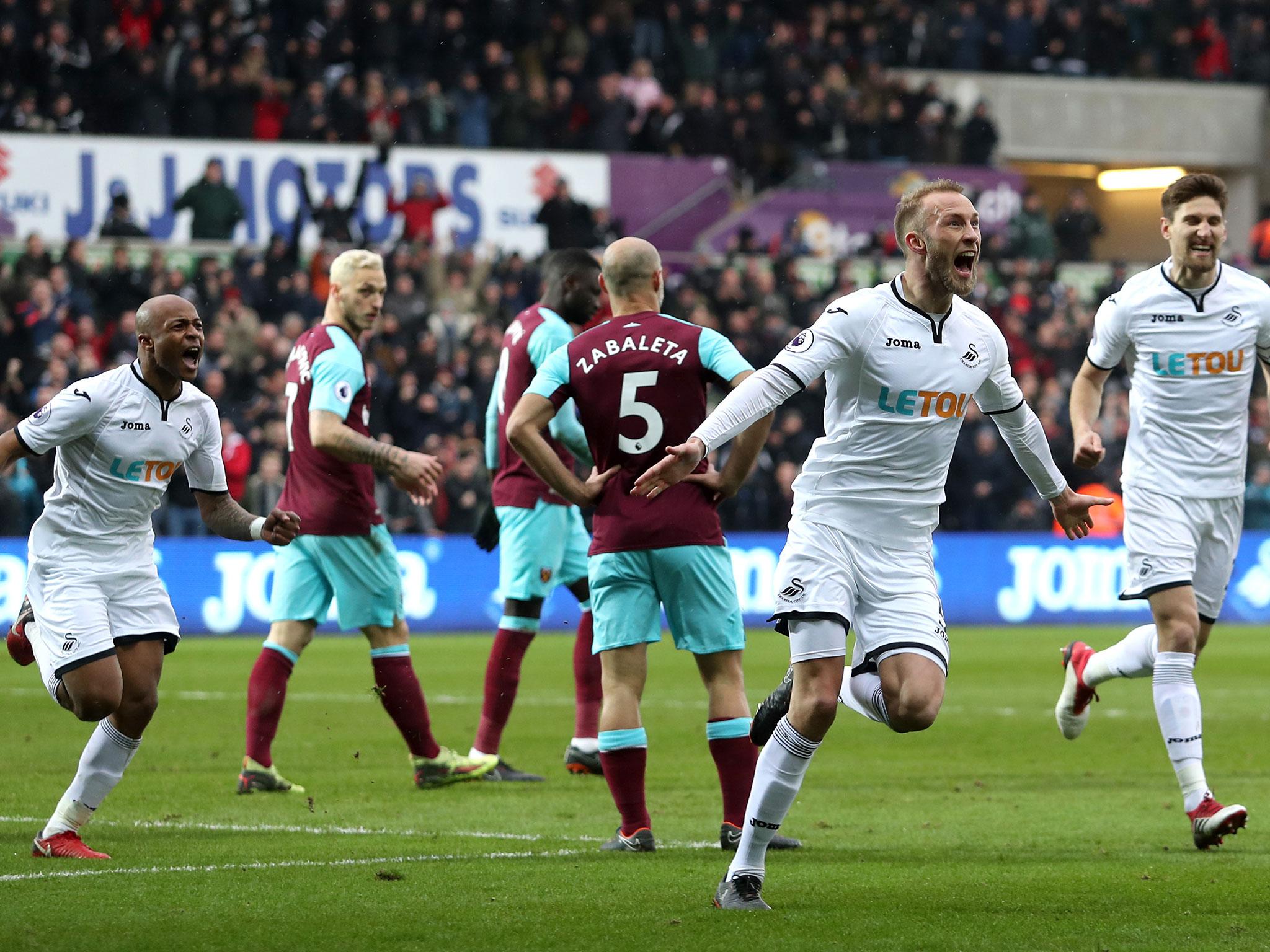 Mike van der Hoorn celebrates Swansea's second goal of the match
