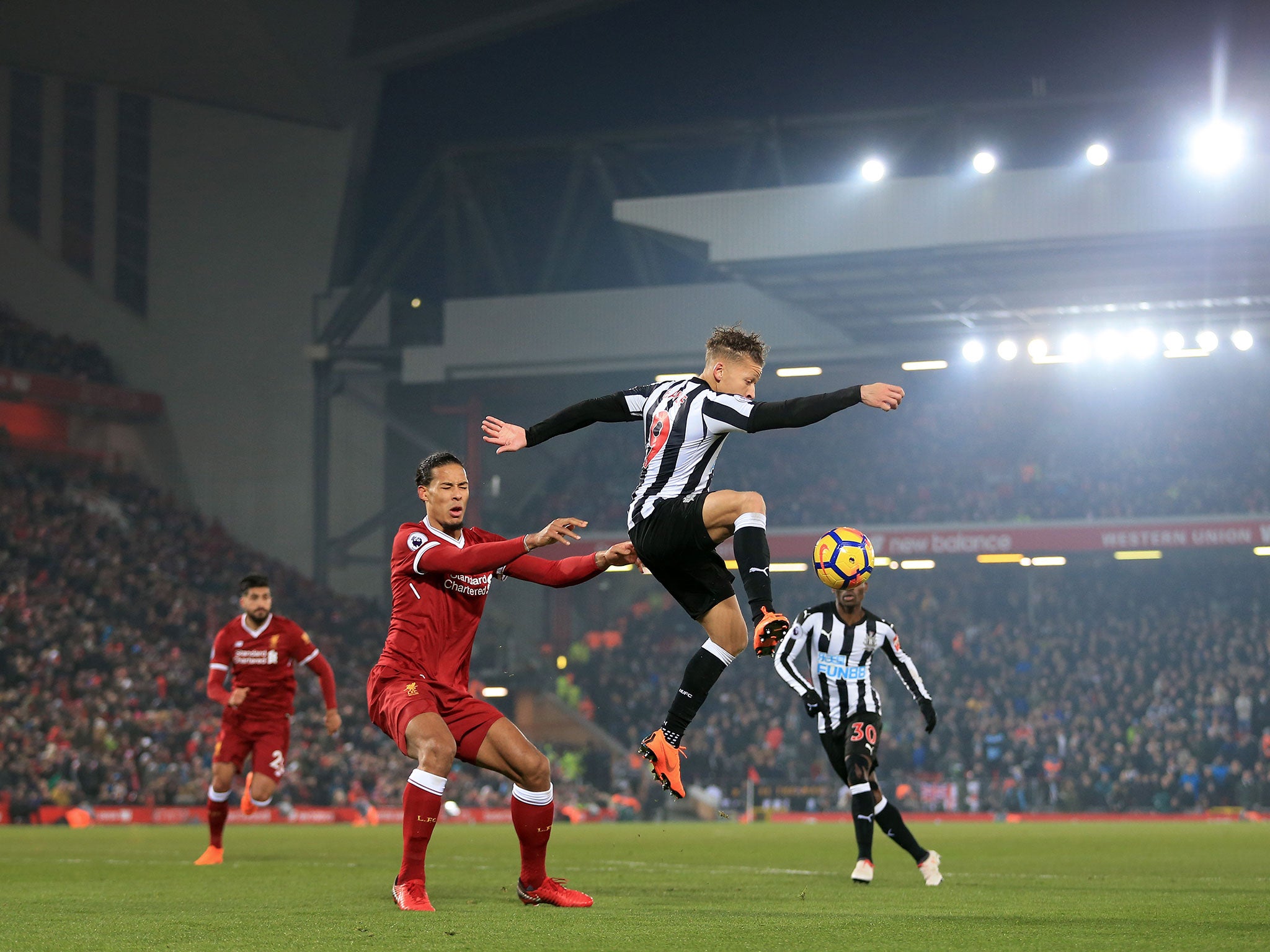 Dwight Gayle brings a high ball under control as Virgil van Dijk pressurises