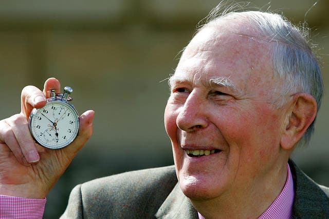 Sir Roger Bannister holds the stop watch used to time his sub-four-minute mile during the 50th anniversary celebrations at Pembroke College, Oxford