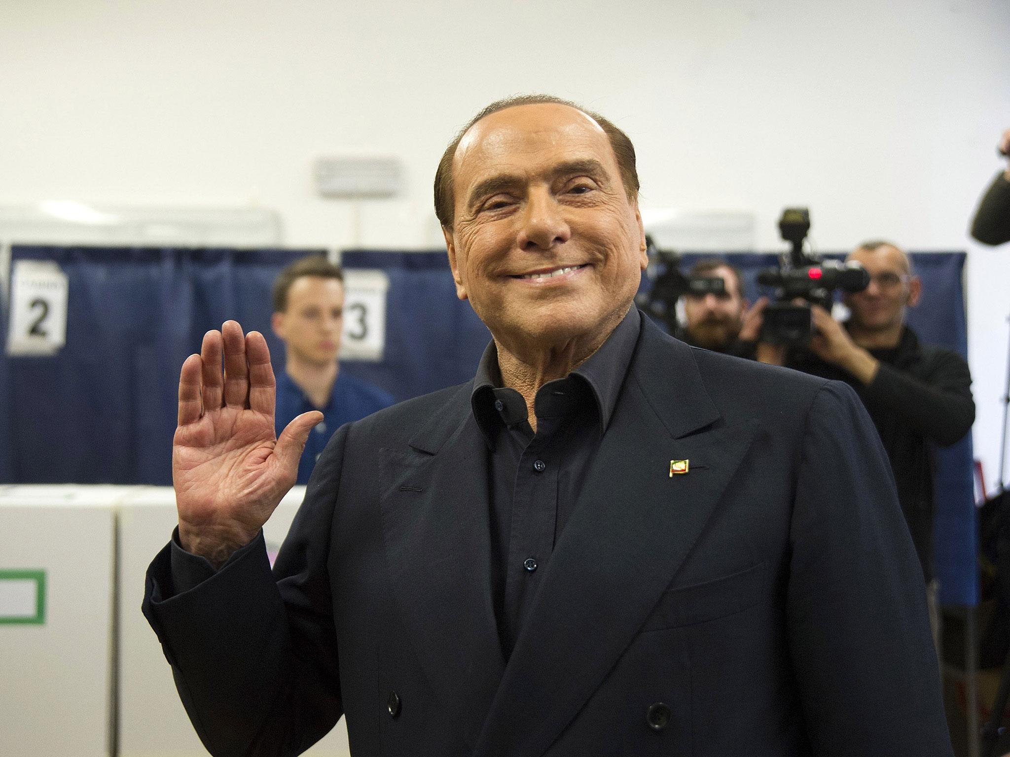 Silvio Berlusconi, the leader of Forza Italia party, attends a polling station in Milan
