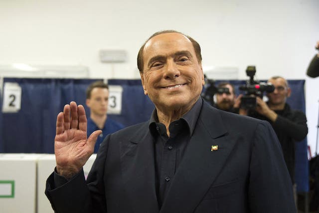 Silvio Berlusconi, the leader of Forza Italia party, attends a polling station in Milan