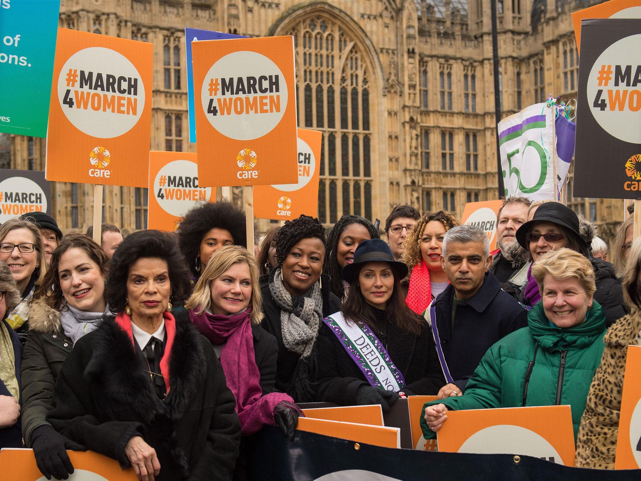 Marchers including (from third left to right) Bianca Jagger, Justine Greening, Natalie Imbruglia, the Mayor of London, Sadiq Khan, and Sandi Toksvig, gather outside the Palace of Westminster ahead of the March4Women