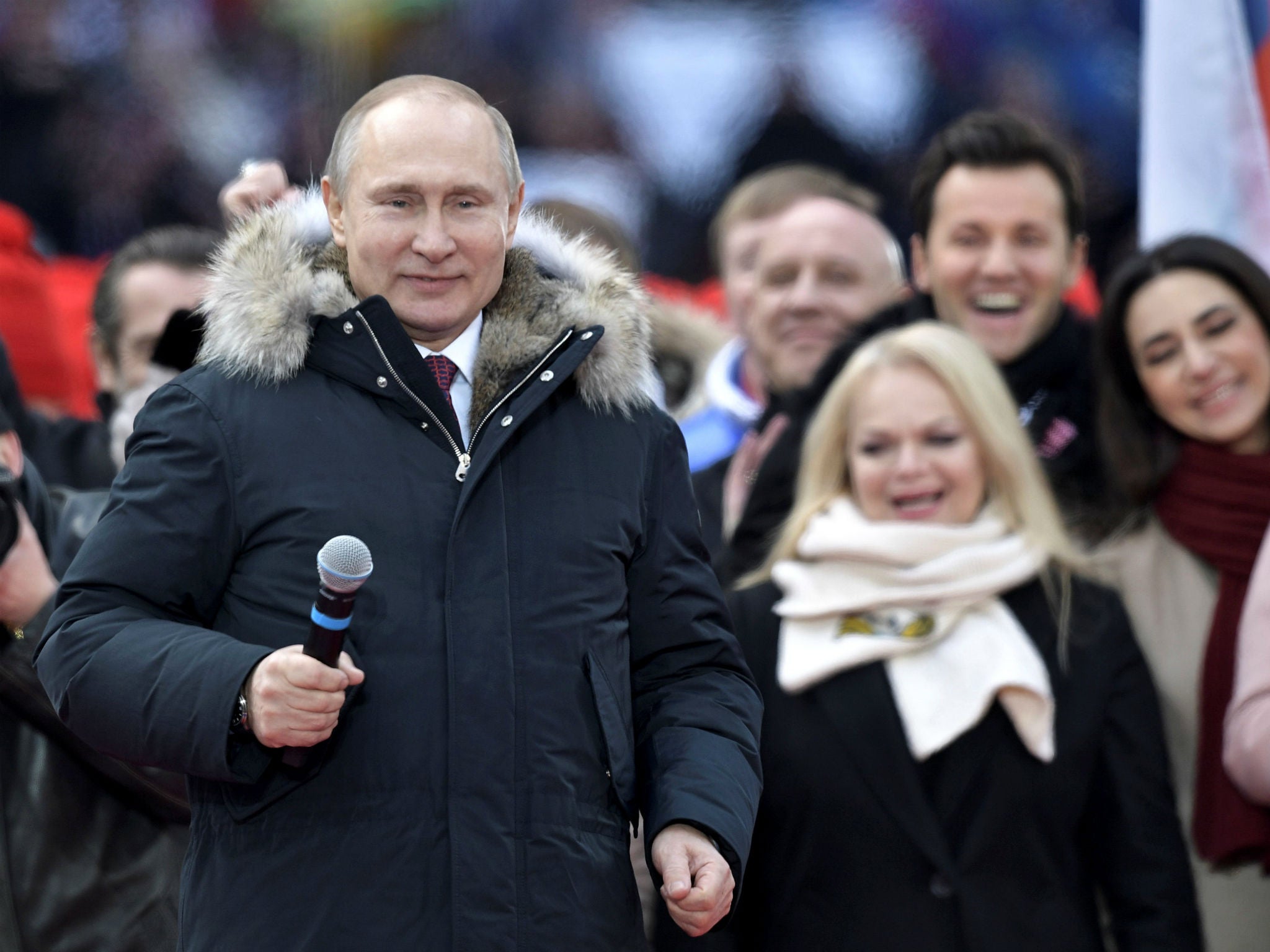 Russian President Vladimir Putin attends a rally to support his bid in the upcoming presidential election in Moscow