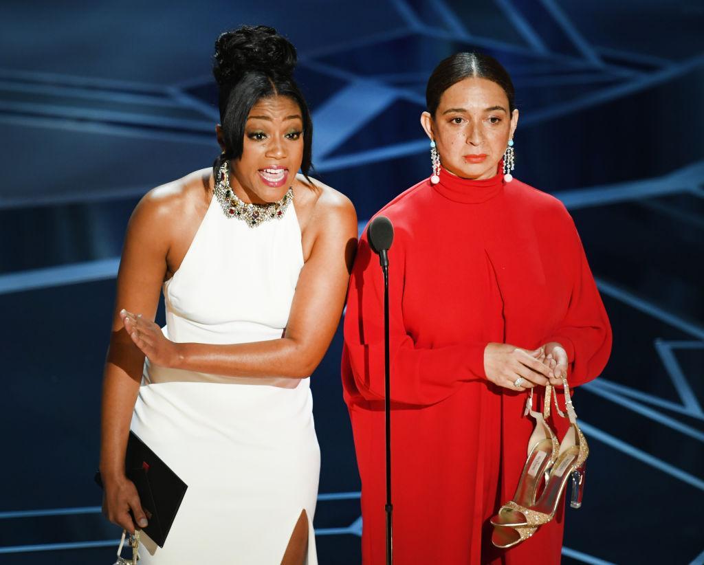Tiffany Haddish (L) and Maya Rudolph speak onstage during the 90th Annual Academy Awards
