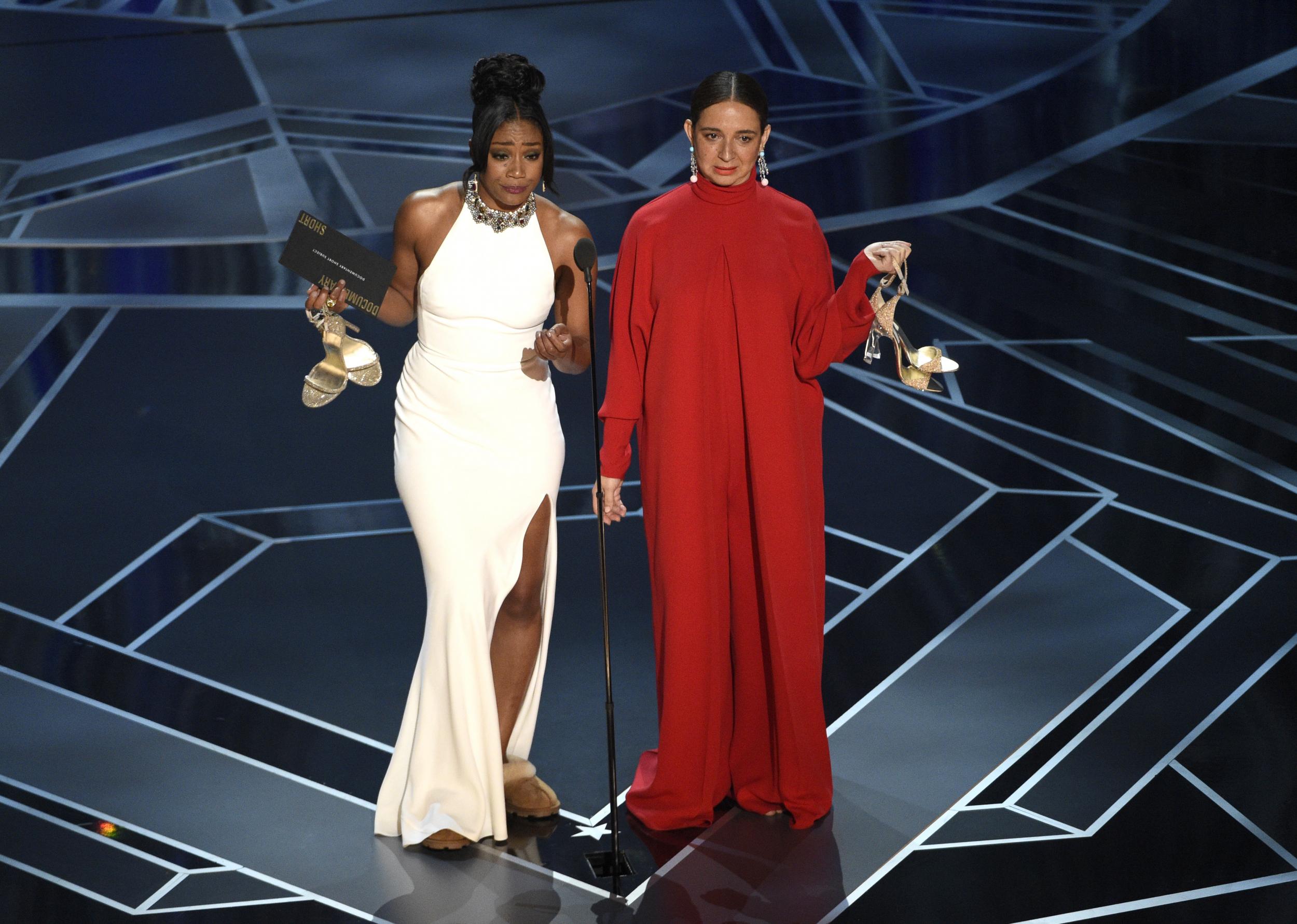 Tiffany Haddish (left) and Maya Rudolph present the Oscar for Best Documentary Short at the 90th Academy Awards