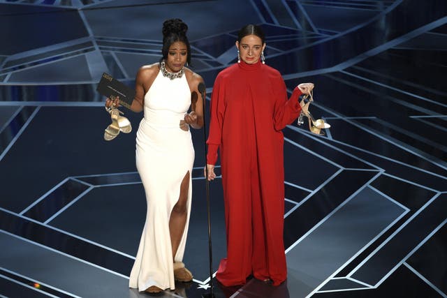 Tiffany Haddish (left) and Maya Rudolph present the Oscar for Best Documentary Short at the 90th Academy Awards 