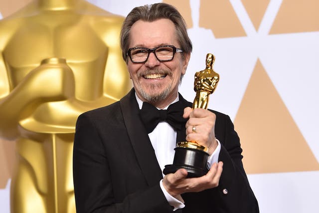 Gary Oldman, winner of the Best Actor award for 'Darkest Hour', poses with his accolade in the press room during the 90th Annual Academy Awards at the Hollywood and Highland Center