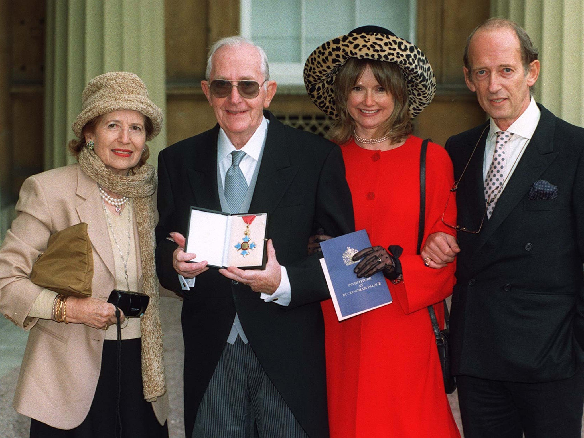 Lewis Gilbert, his wife Hylda, son John and daughter-in-law Joanne, at Buckingham Palace after he was awarded the CBE in 1997. (PA )