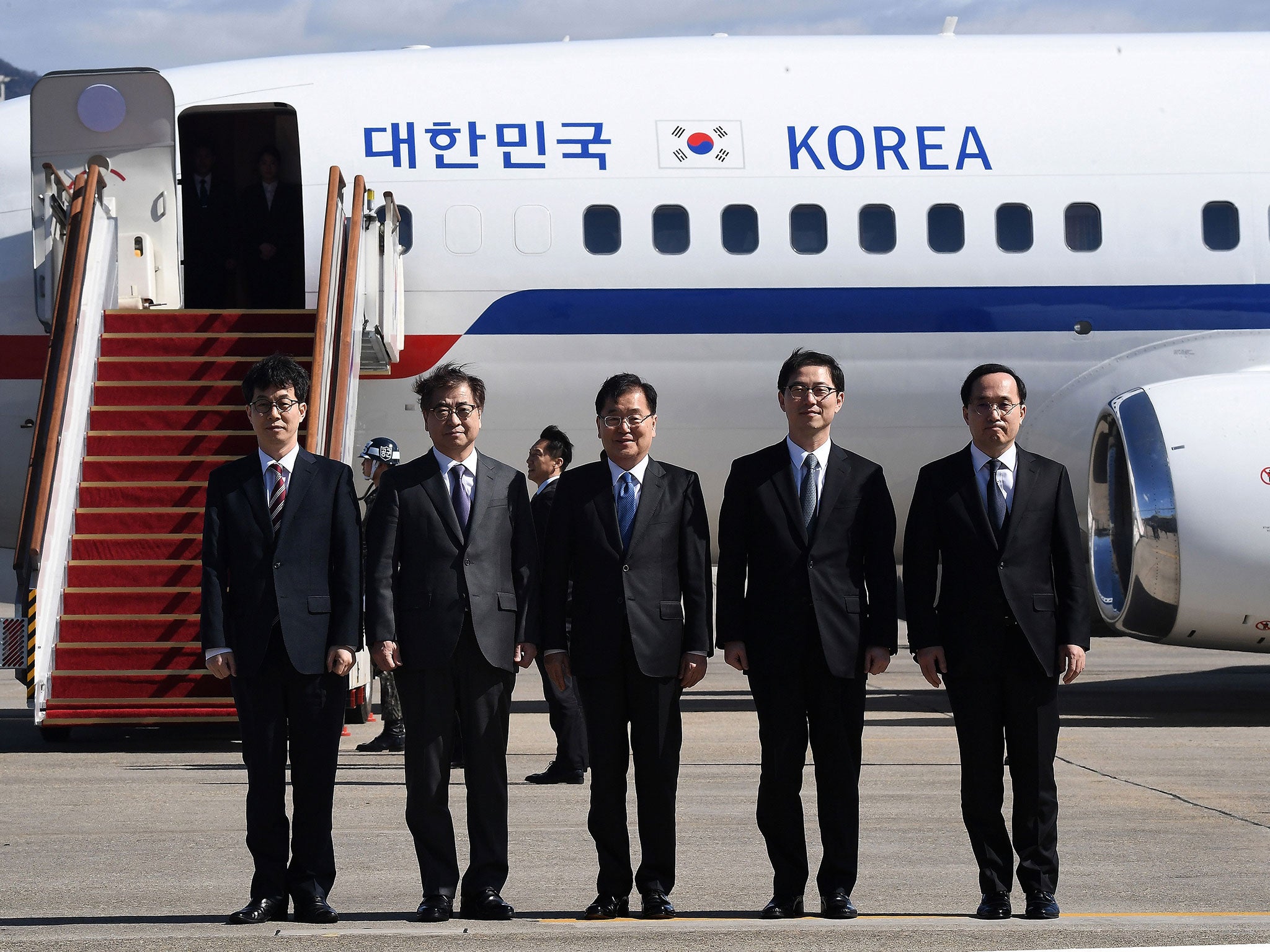 Chung Eui-yong (centre), head of the presidential National Security Office, leaves with the delegation for Pyongyang (Getty)