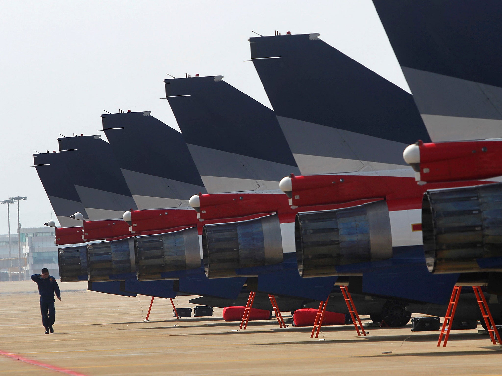 J-10 fighter jets from the 1 August aerobatics team of the People’s Liberation Army air force line up on the tarmac