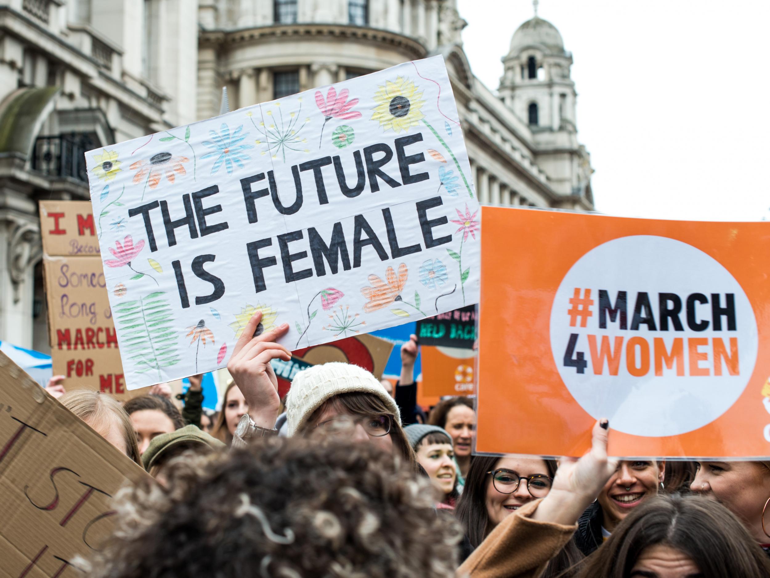 Placards are displayed during the March4Women on 4 March in London