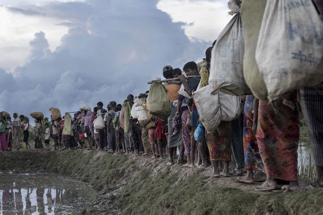Rohingya refugees after crossing the Naf river from Myanmar into Bangladesh in Whaikhyang