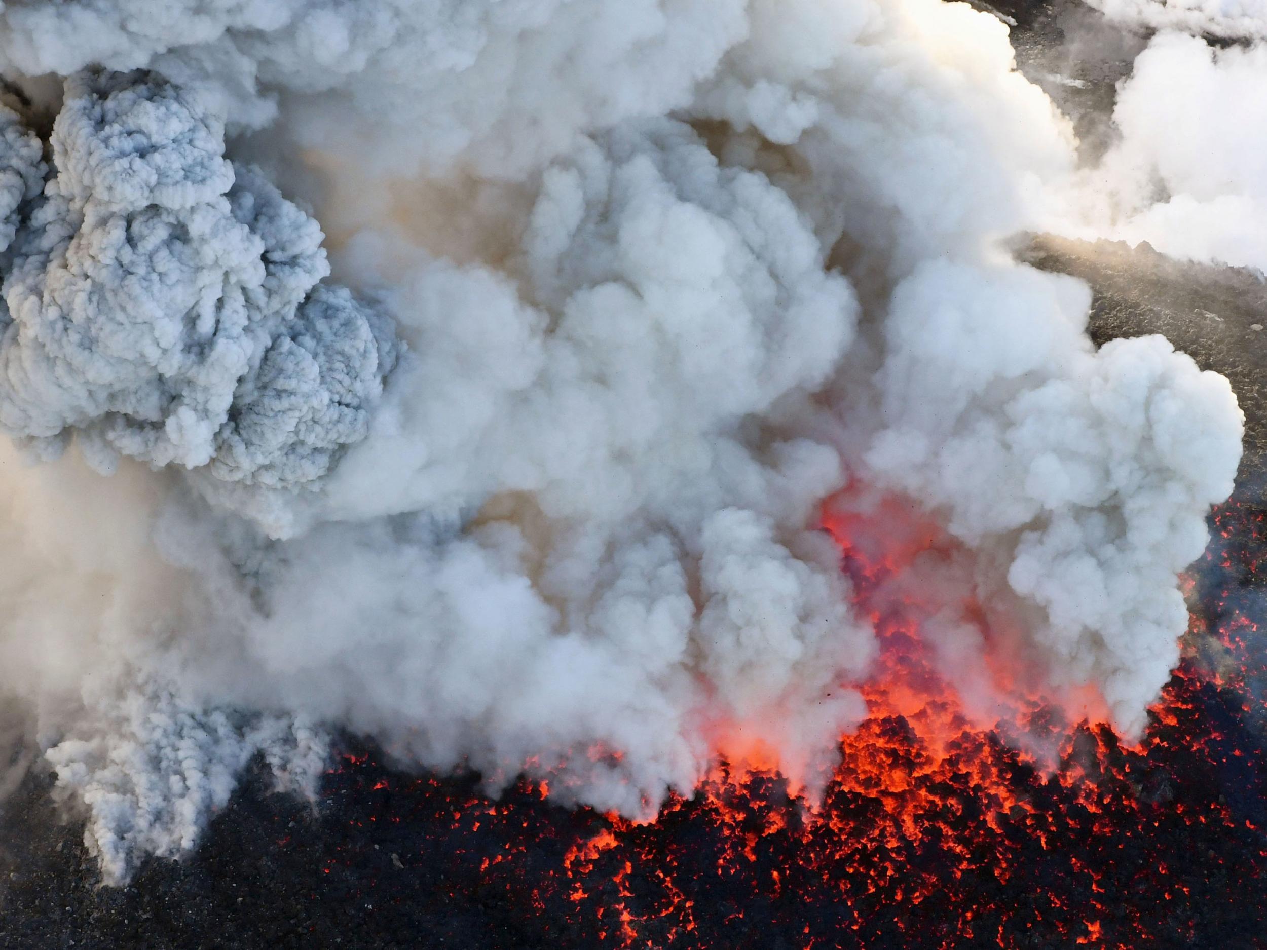 Aerial photography showed the volcano throwing plumes of smoke into the air