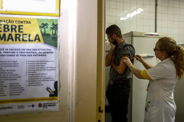 As the disease closes in on Brazil’s biggest cities, officials are rushing to vaccinate 23 million people