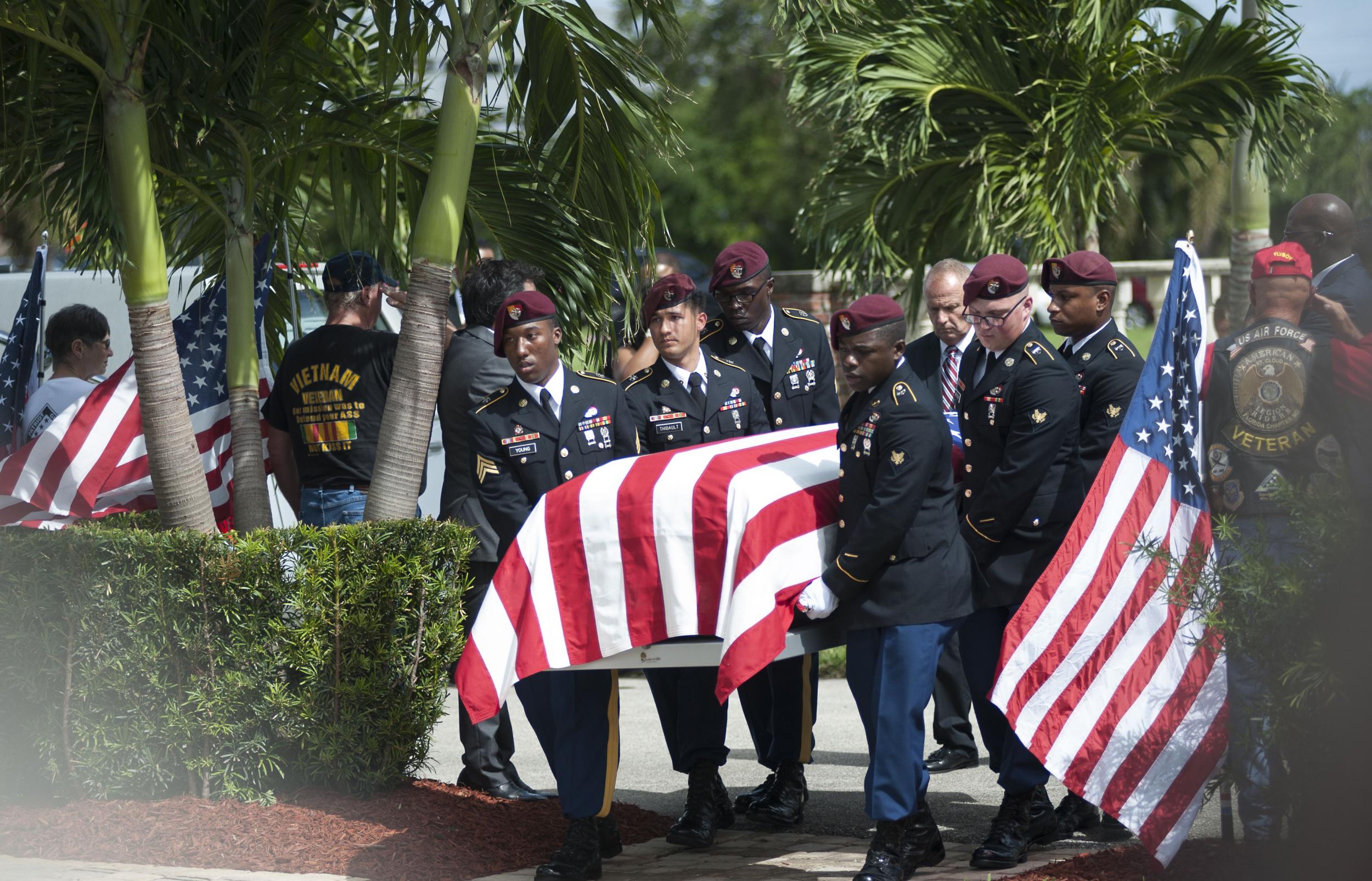 Military honour guards escorting the casket of Sgt La David Johnson, one of the soldiers killed in Niger