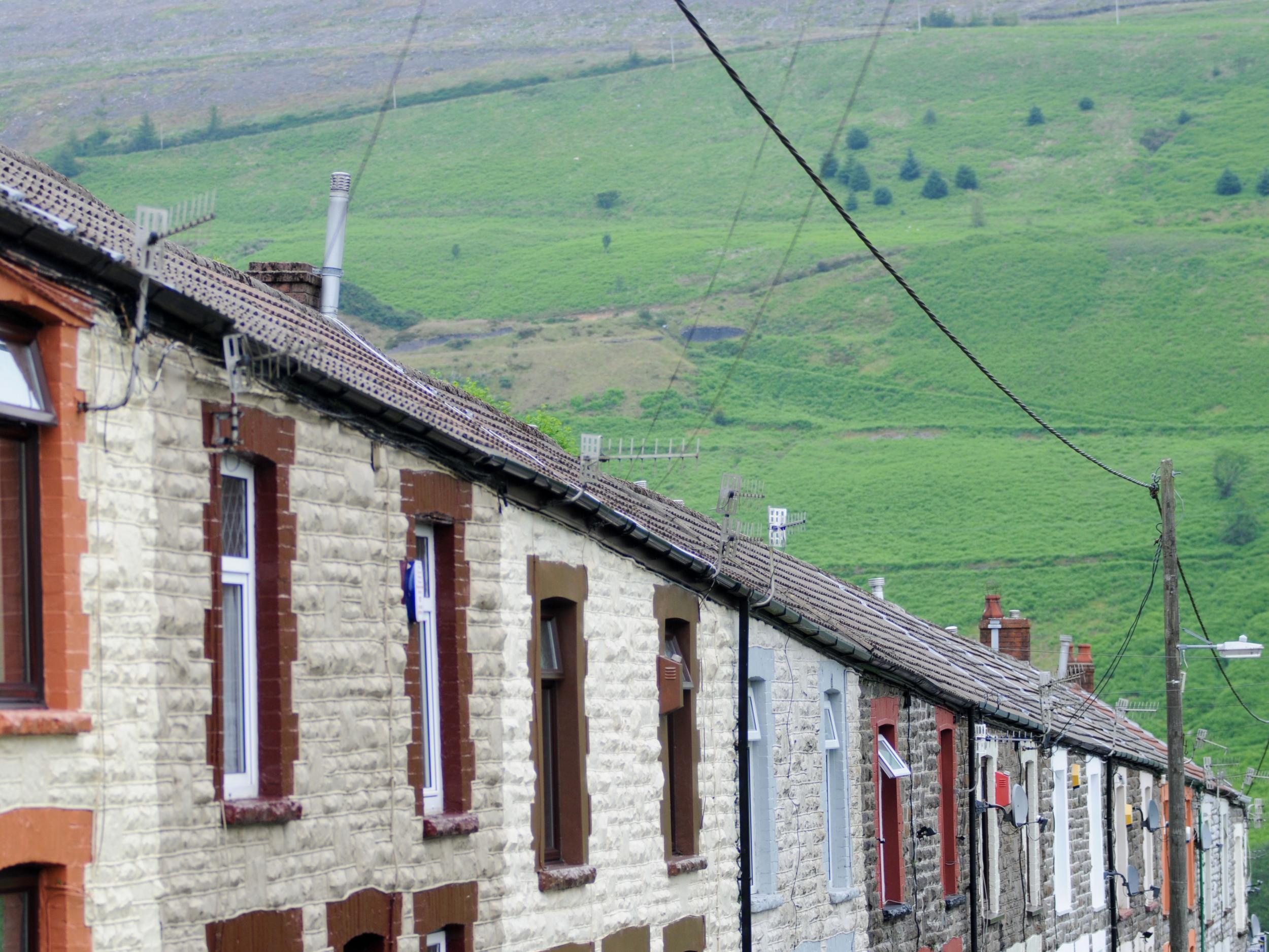 Terraced homes in the Rhondda Valley, south Wales. Poverty is affecting families with members in and out of work, the Joseph Rowntree Foundation said