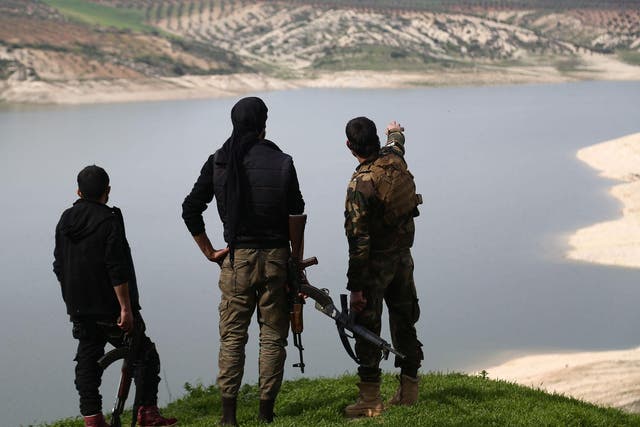 Turkish-backed Free Syrian Army fighters by Lake Maydanki, north of Afrin, after they took control of the nearby village of Ali Bazan on Sunday