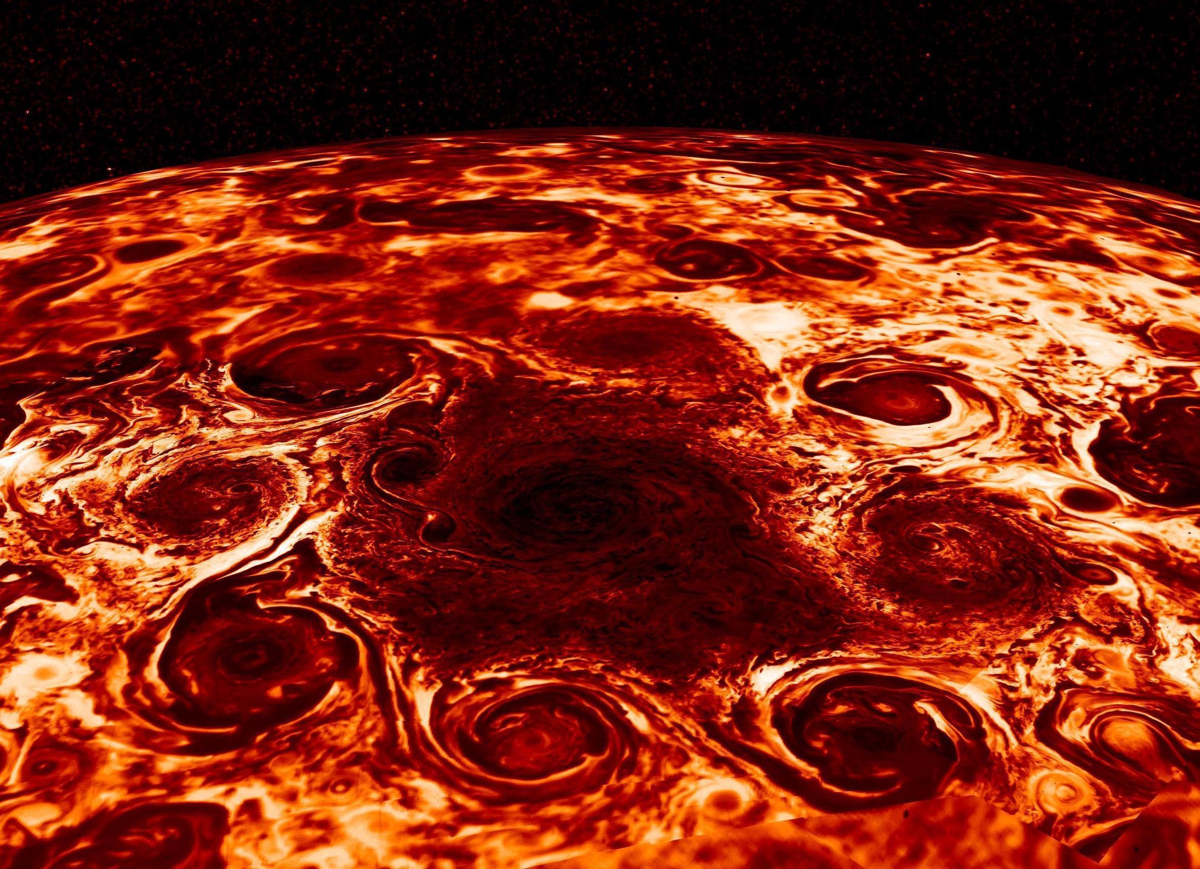 In this composite image, derived from data collected by the Jovian Infrared Auroral Mapper (JIRAM) instrument aboard NASA's Juno mission to Jupiter, shows the central cyclone at the planet's north pole and the eight cyclones that encircle it