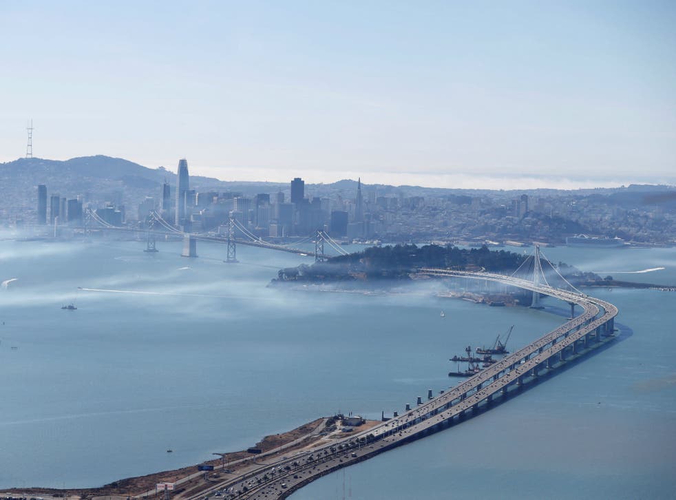 The San Francisco-Oakland Bay Bridge and San Francisco are seen from Oakland, California