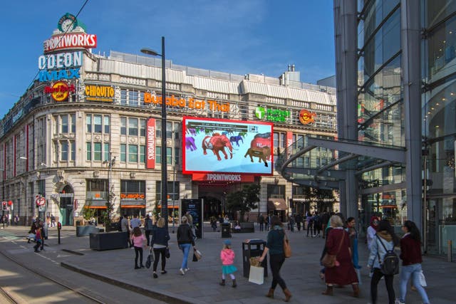 A digital elephant sponsored by The Independent appears on screen in Manchester