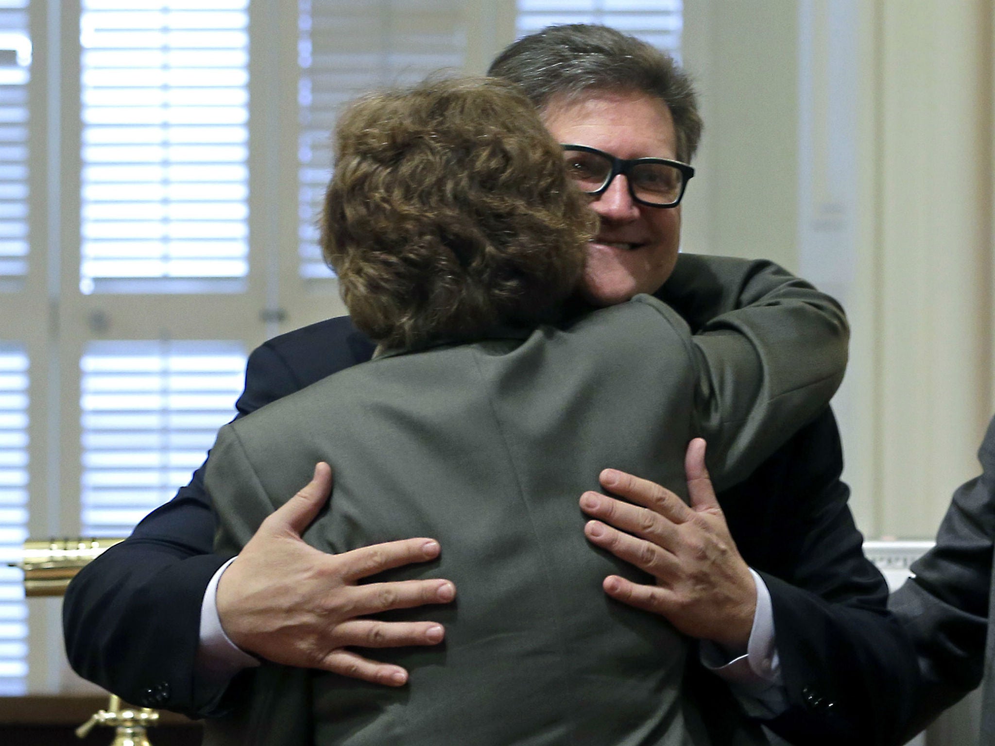 Senator Bob Hertzberg, seen here hugging a female Senator in Sacramento, was told to stop initiating hugs