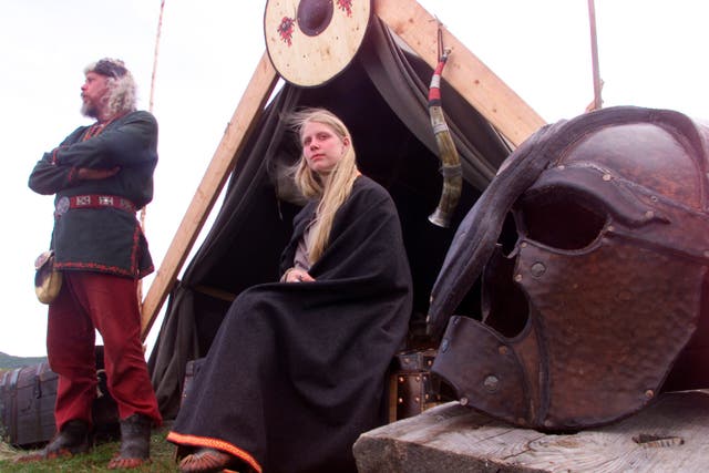 A father and daughter dressed as Vikings in L'Anse aux Meadows in Newfoundland, already known as an early European settlement