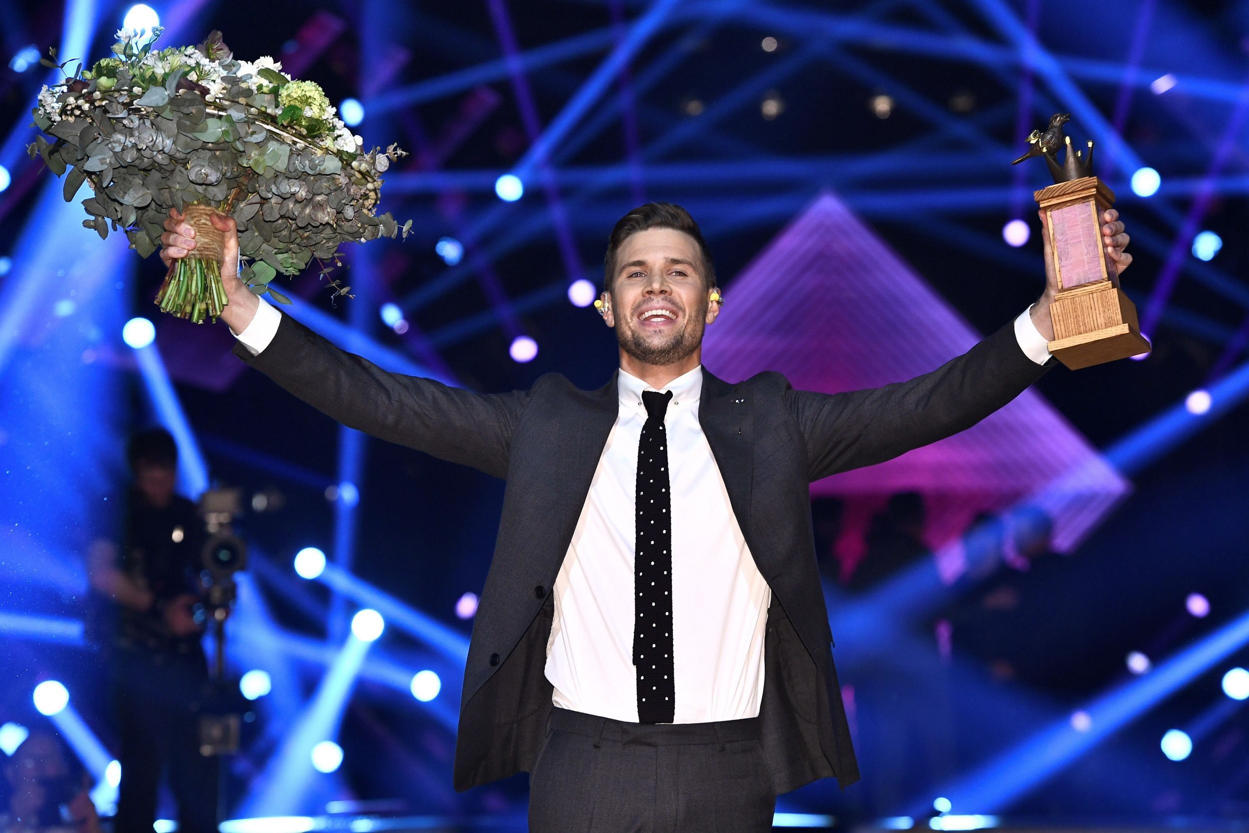 Singer Robin Bengtsson celebrates winning the finale in the Swedish song contest 'Melodifestivalen' with the entry 'I Can't Go On' at the Friends Arena in Stockholm, on March 11, 2017