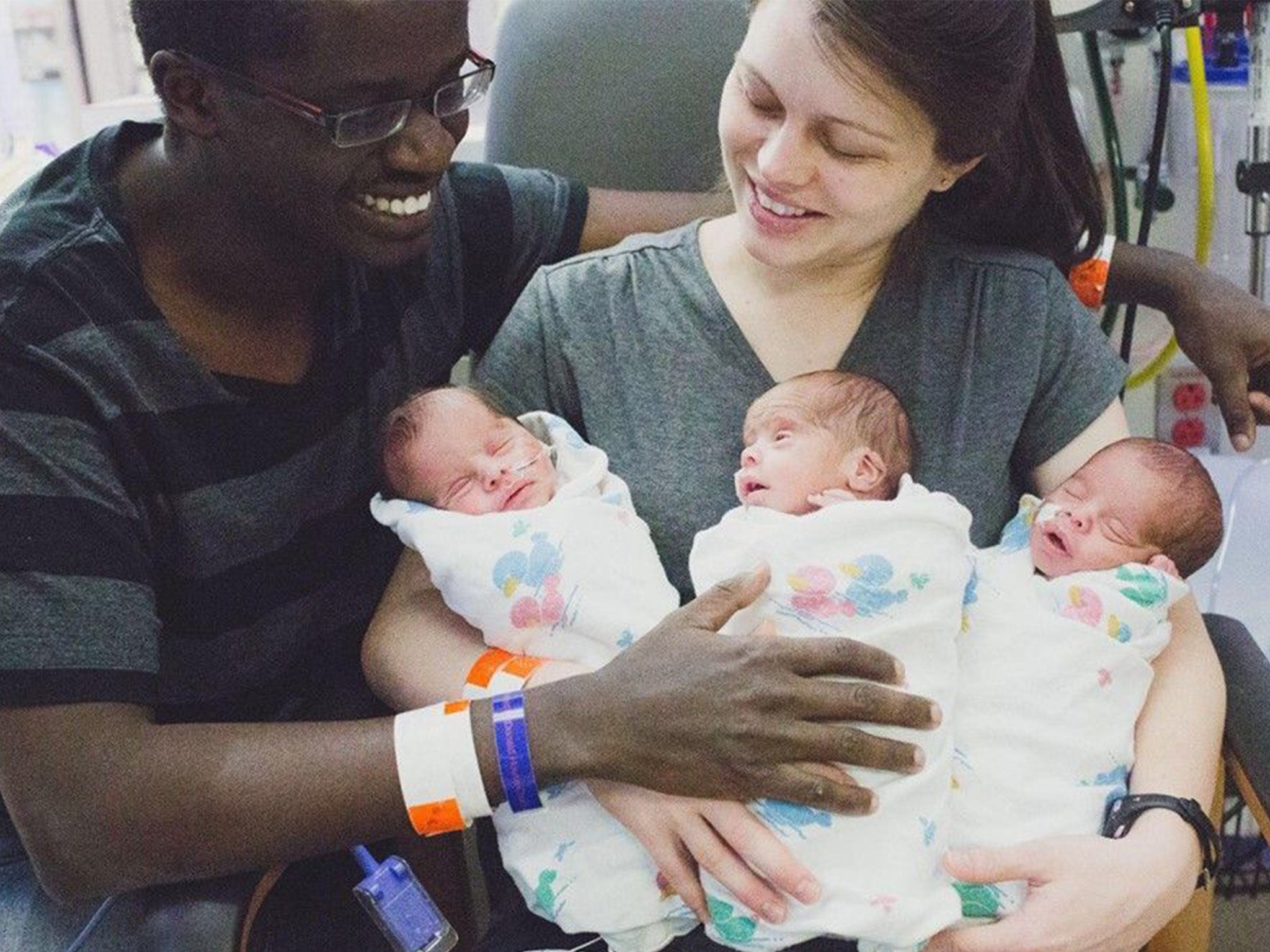 Parents Caleb and Nicole Choge with their newborn sons Ron, Elkanah and Abishai