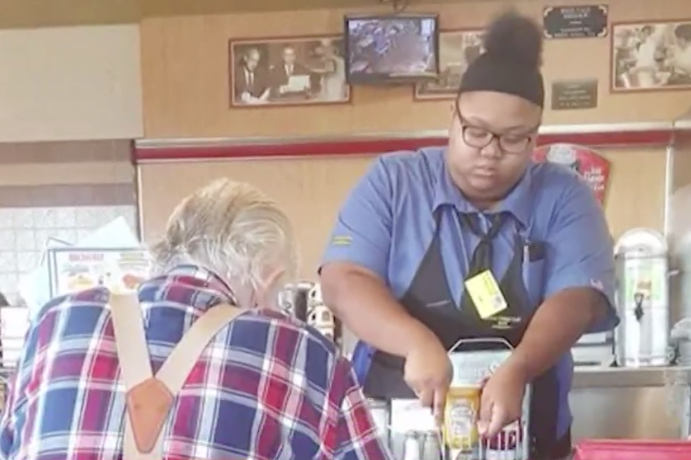 A photo of a teen waitress cutting up an elderly diner's food goes viral (KHOU)