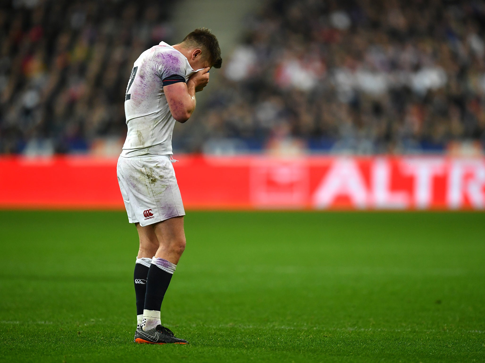 Owen Farrell of England looks dejected