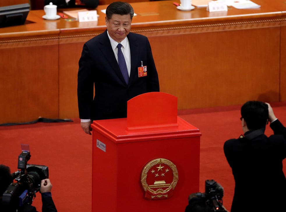 Xi Jinping led members of th Communist Party's seven-member all-powerful Politburo Standing Committee in casting their votes on a constitutional amendment lifting presidential term limits