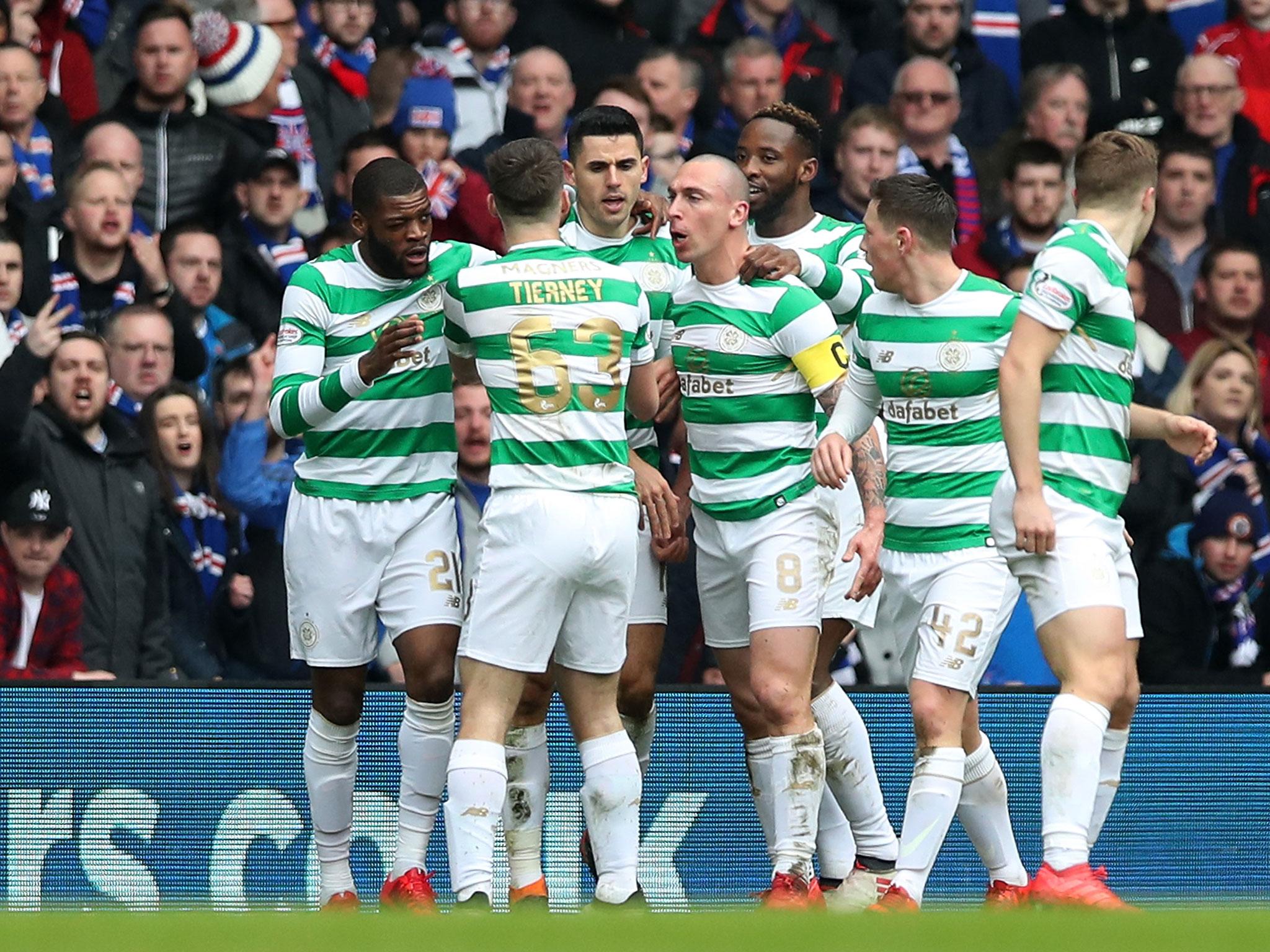 Celtic's players celebrate after Tomas Rogic's equaliser
