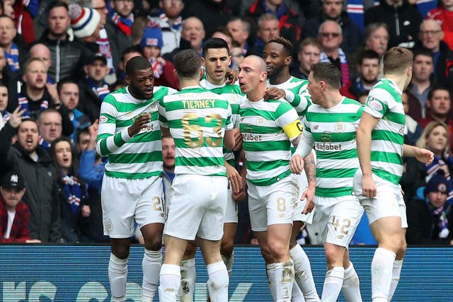 Celtic's players celebrate after Tomas Rogic's equaliser