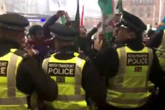 Police guard King's Cross station as protesters gather outside
