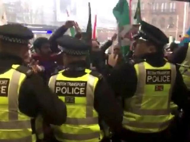 Police guard King's Cross station as protesters gather outside