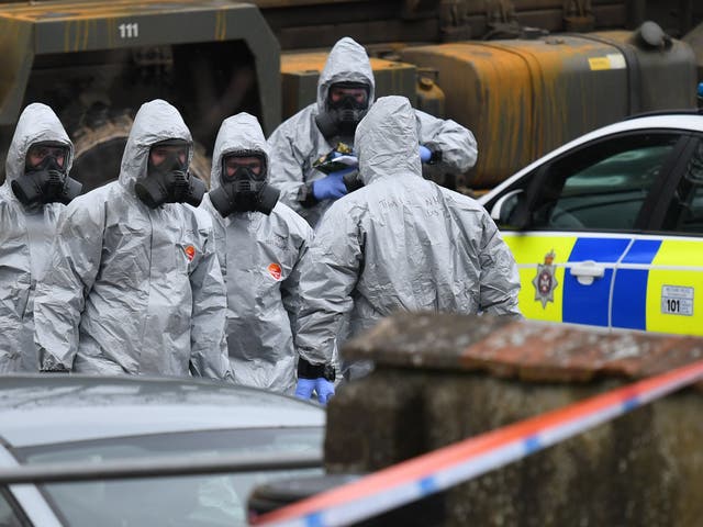 Military in protective clothing prior to removing vehicles from a car park in Salisbury, where Russian ex-spy Sergei Skripal and his daughter were attacked with a nerve agent