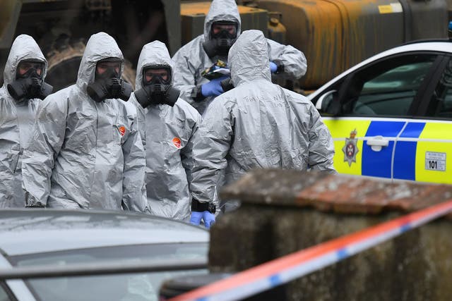 Military in protective clothing prior to removing vehicles from a car park in Salisbury, where Russian ex-spy Sergei Skripal and his daughter were attacked with a nerve agent
