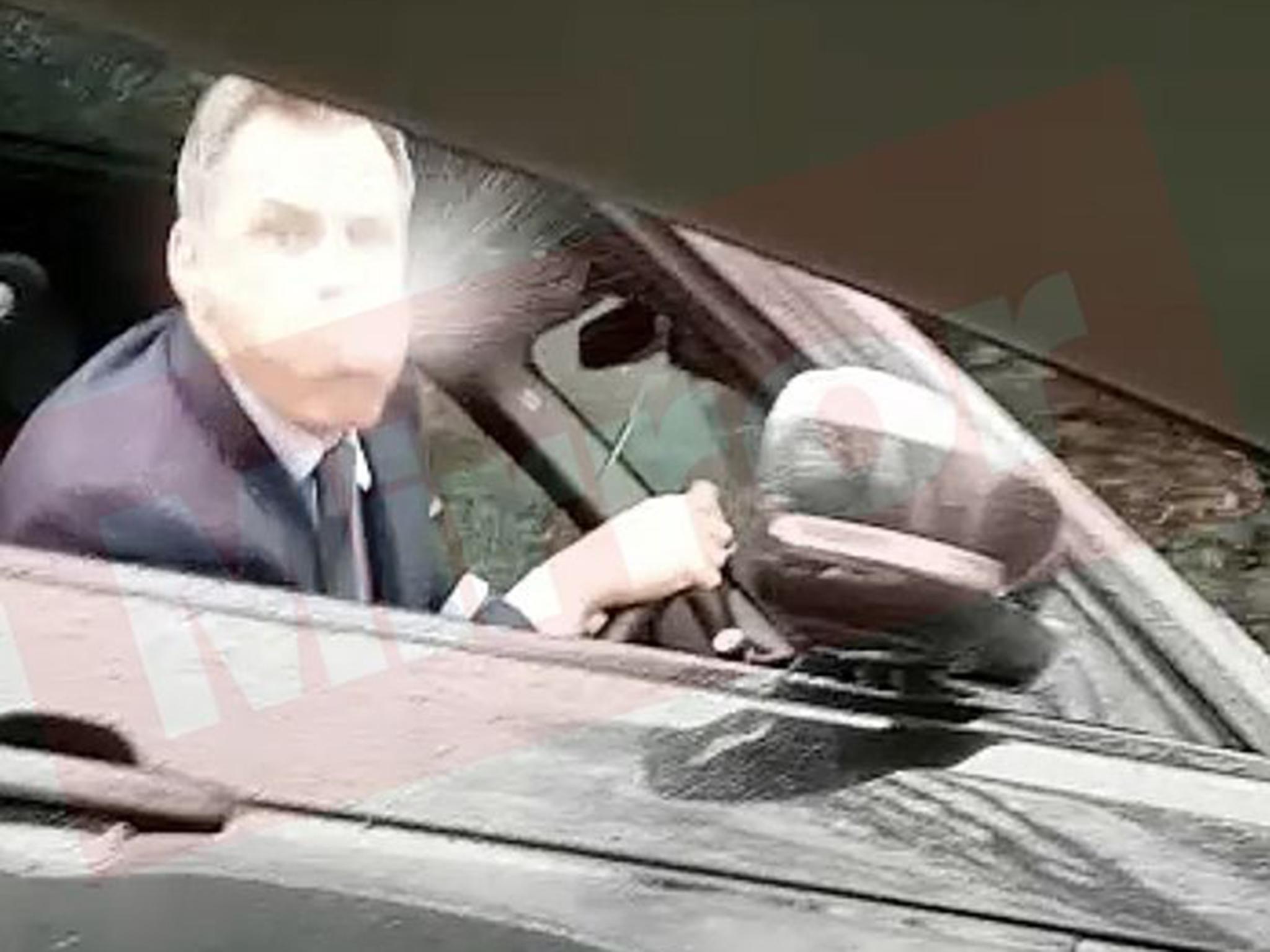 Former Liverpool footballer Carragher spits from his car after being taunted