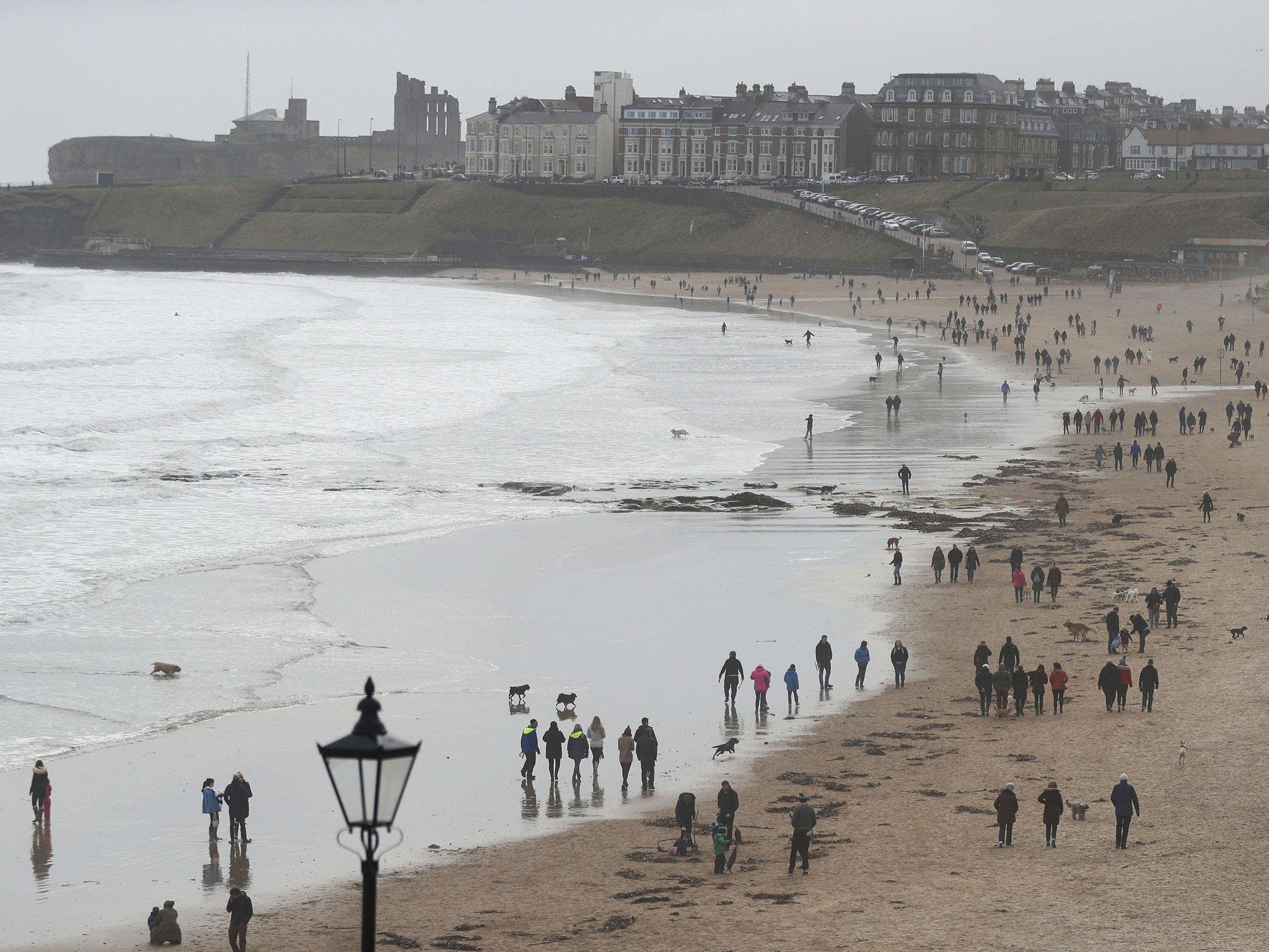 Families take walks along the beach at Tynemouth on Mother's Day. People across the UK enjoyed mostly mild weather on Sunday, but the outlook is expected to turn cold later in the week