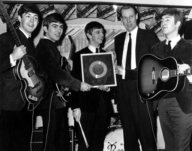 George Martin and the Fab Four hold their silver disk for the debut studio album ‘Please Please Me’