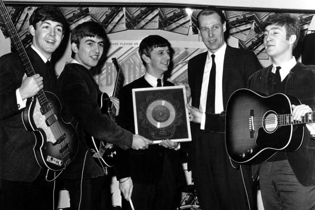George Martin and the Fab Four hold their silver disk for the debut studio album ‘Please Please Me’