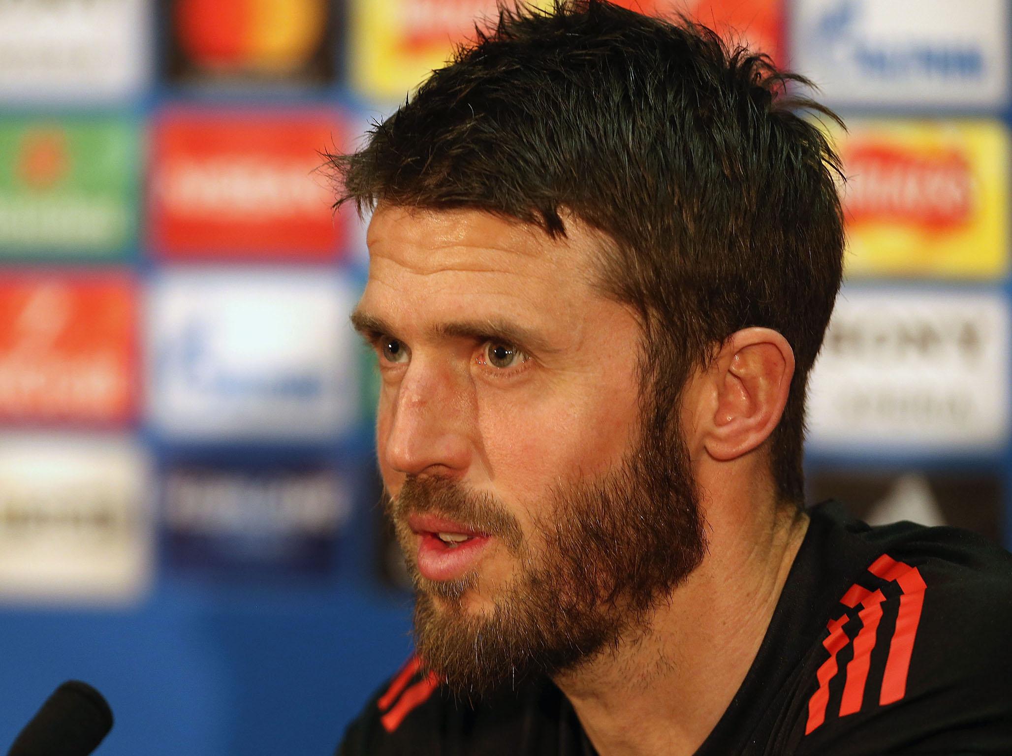 Michael Carrick speaks to reporters at Old Trafford